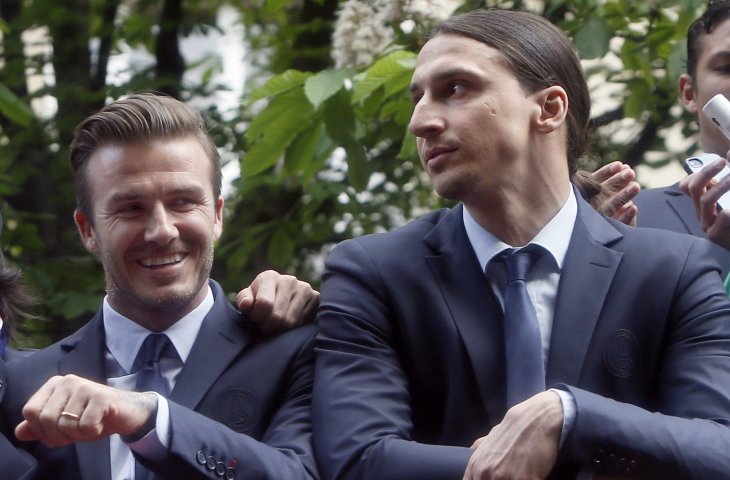 Pemain Paris Saint Germain, David Beckham dan Zlatan Ibrahimovic saat pawai kemenangan PSG di Liga 1 Prancis 2013. (AFP) 