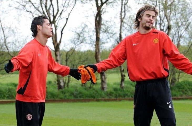 Cristiano Ronaldo dan Gerard Pigue ketika bermain di Manchester United. (Andrew Yates/AFP).