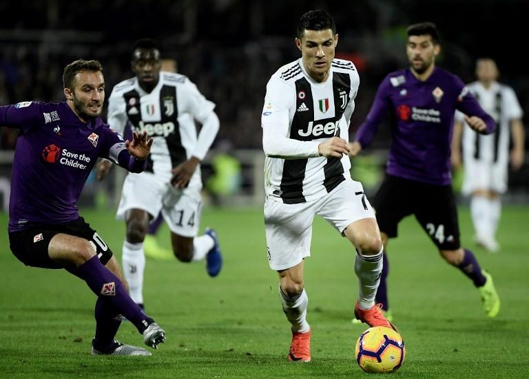 Aksi Cristiano Ronaldo saat melawan Fiorentina di pekan ke-14 Serie A pada 1 Desember 2018 (Filippo Monteforte/AFP)