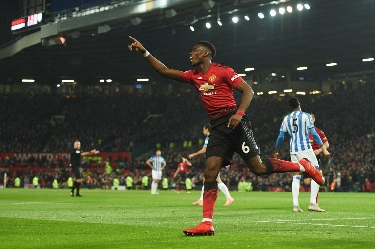 Selebrasi Paul Pogba saat mencetak gol ke gawang Huddersfield Town pada 26 Desember 2018 (Oli Scarff/AFP)