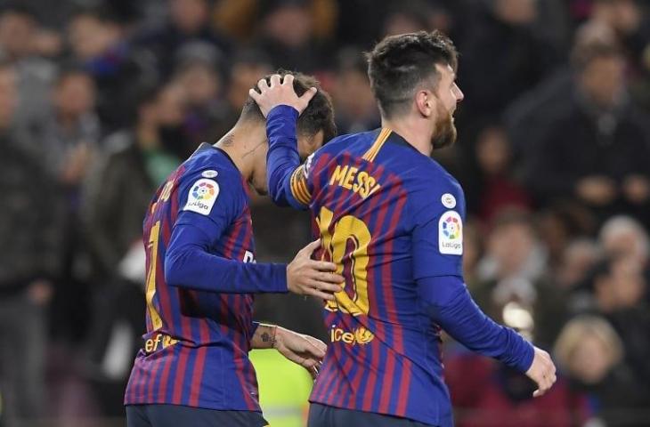 Philippe Coutinho dan Lionel Messi saat melawan Sevilla pada 30 Januari 2019 (Lluis Gene/AFP)