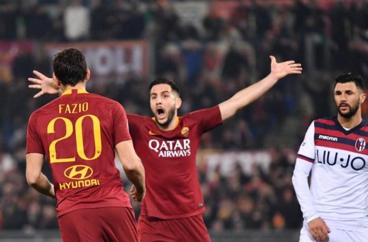 Federico Fazio merayakan gol bersama Kostas Manolas dan memastikan kemenangan AS Roma atas Bologna di pekan ke-24 Serie A, Selasa (19/2/2019) dini hari tadi. Di laga itu AS Roma menang 2-1 dari Bologna. [Alberto PIZZOLI / AFP]