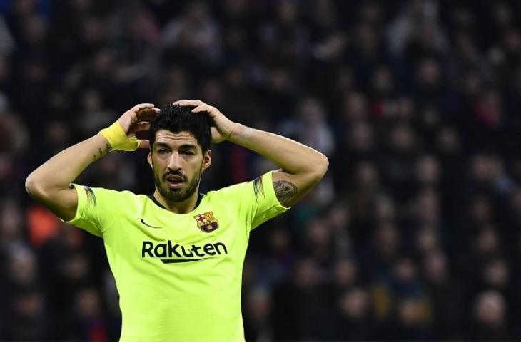 Ekspresi Luis Suarez saat laga melawan Lyon di Liga Champions pada 19 Februari 2019 (Jeff Pachoud/AFP)