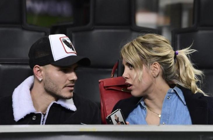 Mauro Icardi dan istrinya, Wanda Nara saat menyaksikan laga Inter Milan vs Rapid Wien di leg kedua Liga Europa pada 21 Februari 2019. (Migeul Medina/AFP)