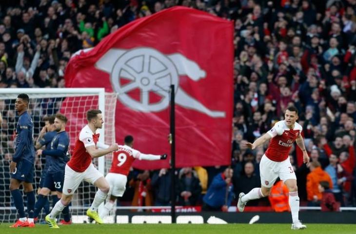 Penyerang Arsenal, Granit Xhaka merayakan golnya ke gawang Manchester United. Pada laga pekan ke-30 Liga Primer Inggris semalam, Arsenal menang 2-0. [IAN KINGTON / IKIMAGES / AFP]