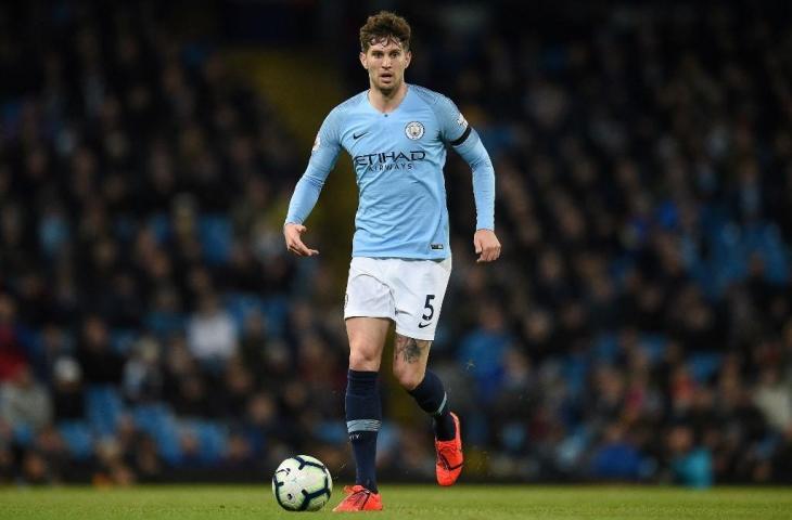 Bek Timnas Inggris yang juga pilar pertahanan Manchester City, John Stones. [OLI SCARFF / AFP]