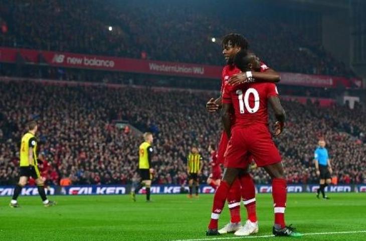 Dua pemain Liverpool, Sadio Mane dan Divock Origi. (ANTHONY DEVLIN / AFP)