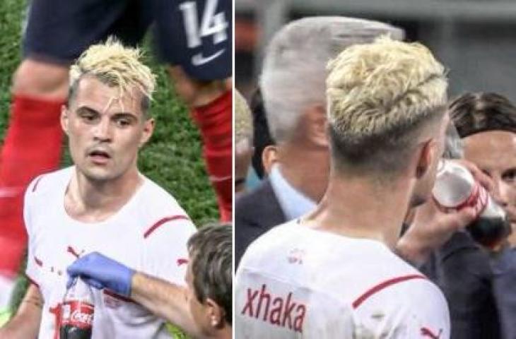 Granit Xhaka minum Coca Cola jelang adu penalti saat laga Prancis vs Swiss. (Twitter/@Route1futbol)