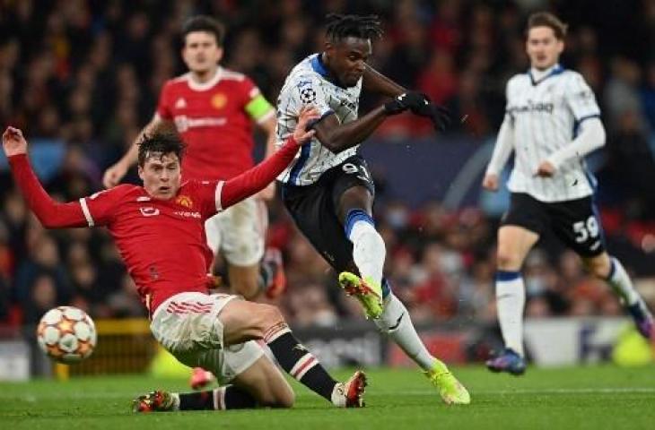 Potret pertandingan saat Manchester United kalahkan Atalanta 3-2 di ajang Liga Champions. (PAUL ELLIS / AFP)