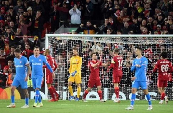 Aksi penyerang Liverpool, Diogo Jota usai bobol gawang Atletico Madrid di Liga Champions. (OLI SCARFF / AFP)