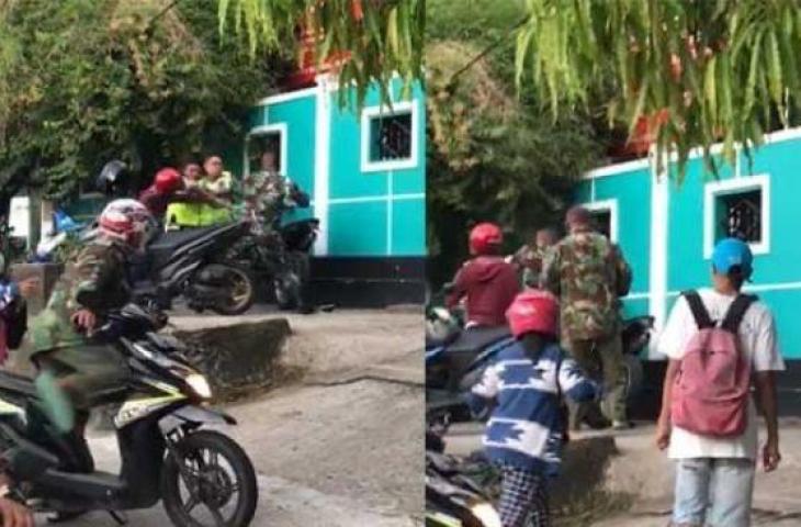 Tangkapan layar dua pria berseragam mirip Polantas adu jotos dengan sosok berpakaian mirip TNI. [Ist]