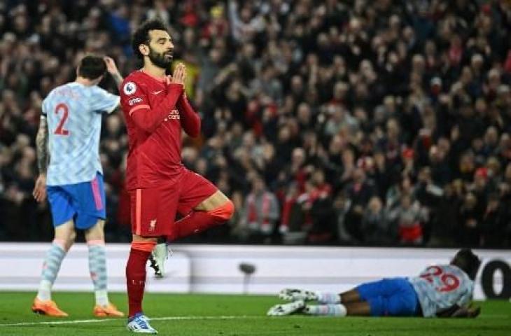 Selebrasi Mohamed Salah usai saat cetak gol saat Liverpool hajar Manchester United 4-0. (OLI SCARFF / AFP)