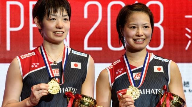 Pasangan ganda putri Jepang, Yuki Fukushima/Sayaka Hirota. [AFP/Anthony Wallace]