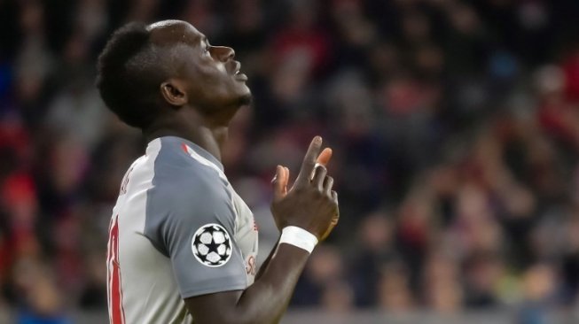 Striker Liverpool Sadio Mane merayakan golnya ke gawang tuan rumah Bayern Munich di Liga Champions. GUENTER SCHIFFMANN / AFP 