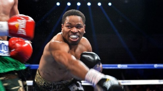 Juara dunia kelas welter WBC, Shawn Porter. [AFP/Nicholas Kamm]