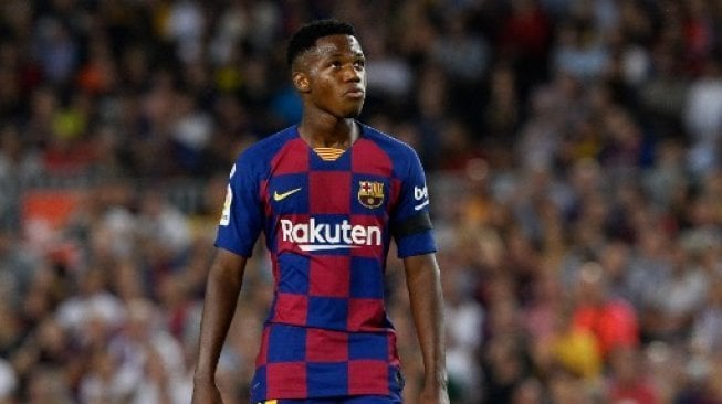 Reaksi pemain muda Barcelona Ansu Fati saat menghadapi Valencia di Camp Nou, Minggu (15/9/2019). [AFP]