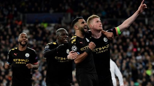 Pemain Manchester City merayakan gol Kevin De Bruyne ke gawang Real Madrid di leg pertama babak 16 besar Liga Champions di Santiago Bernabeu stadium. JAVIER SORIANO / AFP