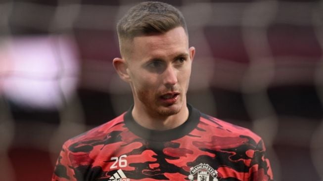 Kiper Manchester United saat melakukan pemanasan jelang laga Liga Europa 2020/2021 kontra AC Milan di Old Trafford, Jumat (12/3/2021). [Oli SCARFF / AFP]